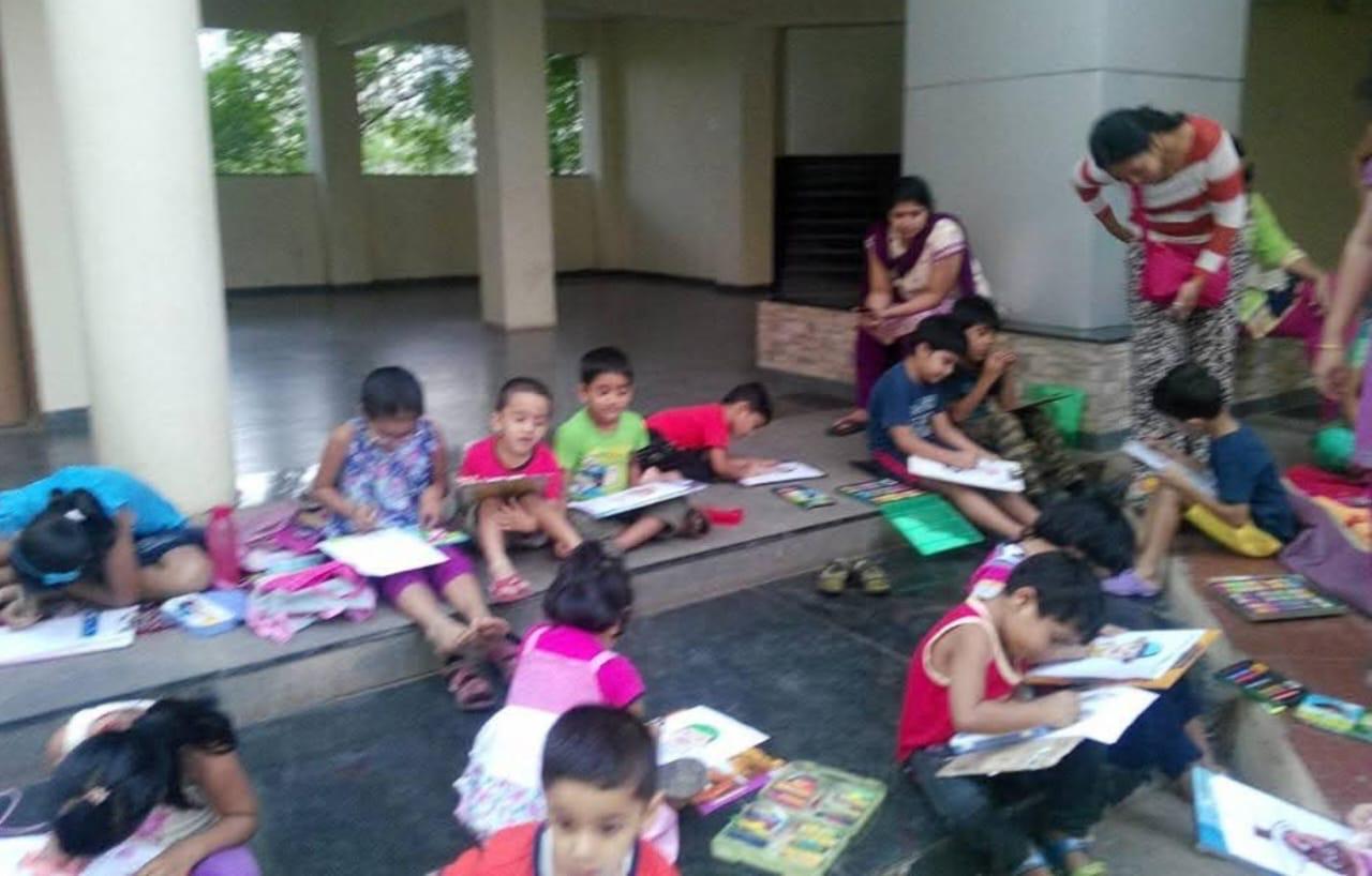 Children showing their artwork