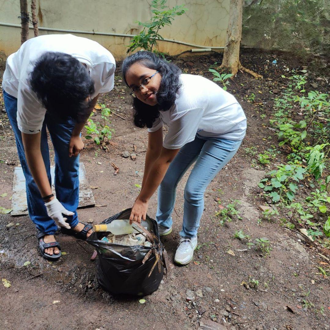 Volunteers cleaning community spaces